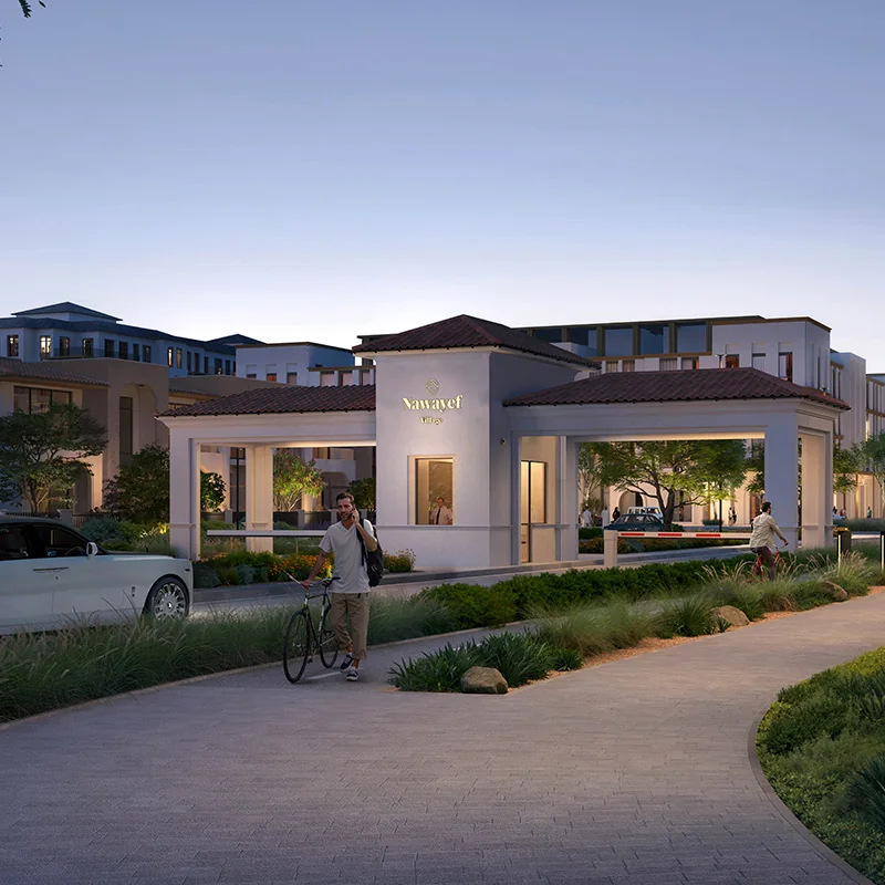 Gated community entrance at South Hill by Modon at dusk